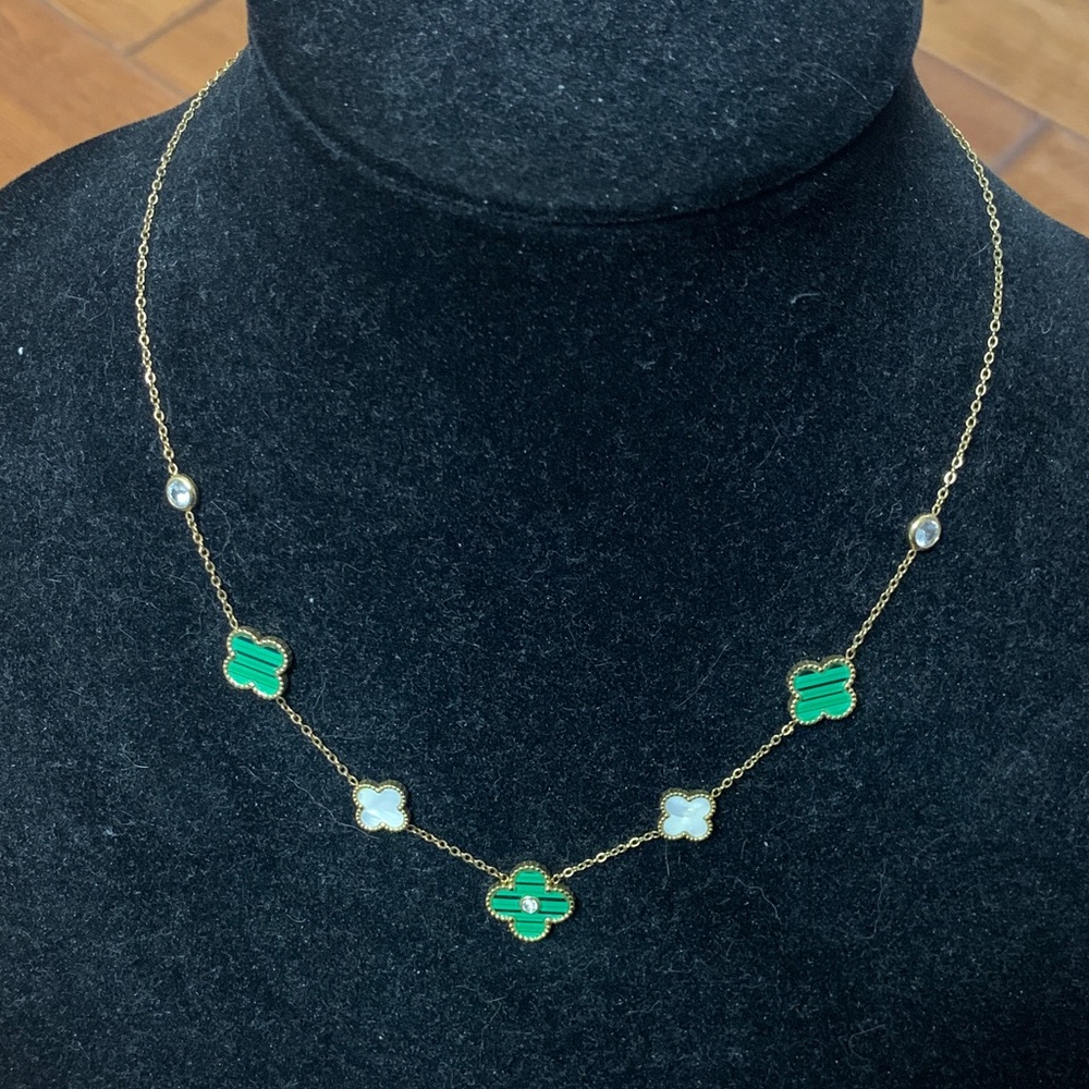 Gold tone green and mother of pearl look clovers necklace - Preowned